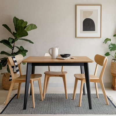 Wyld Haus Saffron Rectangular Oak Veneer Dining Table With Matte Black Base from B&Q