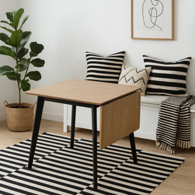Wyld Haus Saffron Extending Dining Table With Natural Oak Veneer And Black Base from B&Q