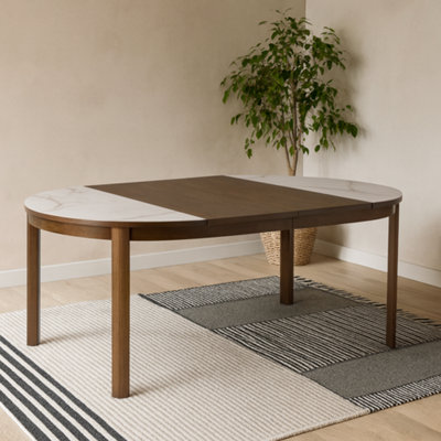 Wyld Haus Cork Round Extendable Cream Ceramic Dining Table With Oak Veneer Base from B&Q