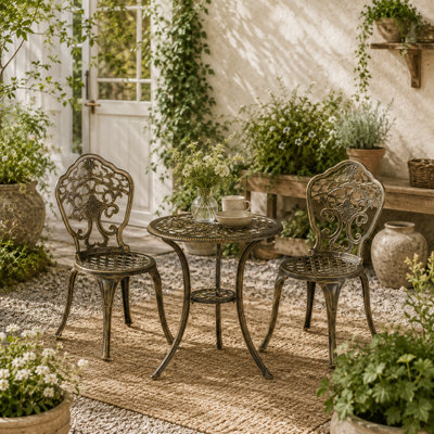 Wyld Haus Bava Bronze Cast Aluminium 3-Piece Garden Bistro Set With Parasol HoleRound Table from B&Q