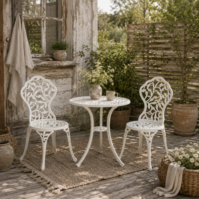 Wyld Haus Karipa White Cast Aluminium 3-Piece Outdoor Floral Bistro Set2 Chairs And Round Table from B&Q