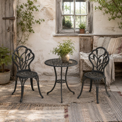 Wyld Haus Fafire 3-Piece Bronze-Tone Aluminium Bistro Set2 Chairs And Round Table With Parasol Hole from B&Q