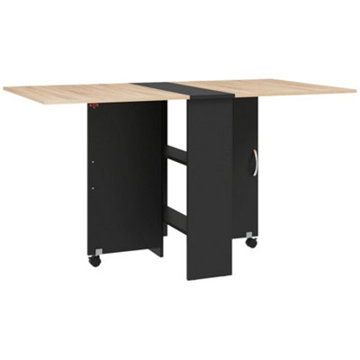 Wyld Haus Toelka Oak And Black Extendable Drop-Leaf Dining Table With Shelves And Castors from B&Q
