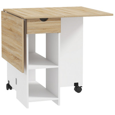Wyld Haus Coyova Layo Oak And White Folding Drop Leaf Dining Table With Drawer And Shelves from B&Q