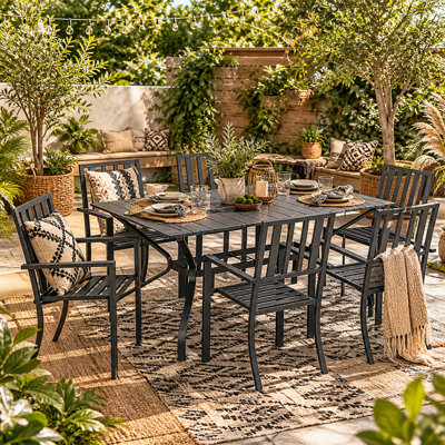 Wyld Haus Suri 7-Piece Metal Outdoor Dining Set6 Stackable Chairs And 150 X 90 Cm Rectangular Table With Parasol Hole from B&Q