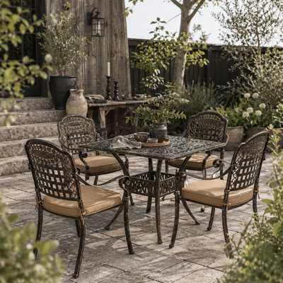 Wyld Haus Monake 4 Seater Bronze Cast Aluminium Outdoor Garden Dining SetSquare Table With 4 Cushioned Chairs from B&Q