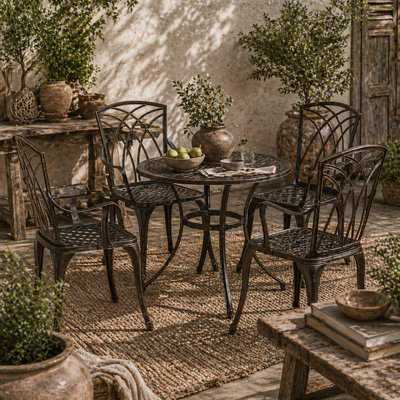 Wyld Haus Sake 4-Seater Bronze Cast Aluminium Garden Dining SetRound Table 85Cm With 50mm Parasol Hole And 4 Matching Chairs from B&Q