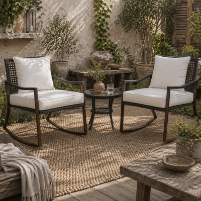 Wyld Haus Madile 3-Piece Rattan Bistro Set With Rocking Chairs And Round Glass Coffee TableBrown Black With Cream Cushions from B&Q