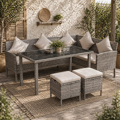 Wyld Haus Mora Rattan 7-Seater Outdoor Dining Set With 2 Sofa Sections2 Footstools And Rectangular Table from B&Q