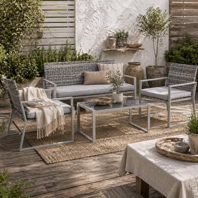 Wyld Haus Kelusu 5-Seater Rattan Garden Sofa Set2 ArmchairsLoveseat And Tempered Glass Coffee Table from B&Q