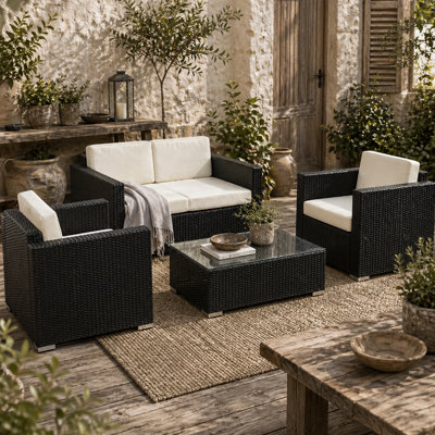 Wyld Haus Elrolo 4-Seater Black Rattan Outdoor Sofa Set With White Cushions And Rectangular Tempered Glass Coffee Table from B&Q
