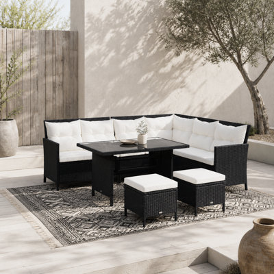Wyld Haus Semapa 8-Seater Black Rattan Corner Dining Sofa Set With Double TableFootstools And Cream Cushions from B&Q