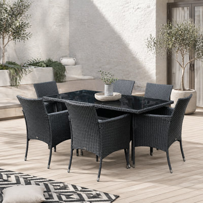 Wyld Haus Loreke Black Rattan 7-Piece Outdoor Dining SetRectangular Glass-Top Table With 6 Armchairs from B&Q