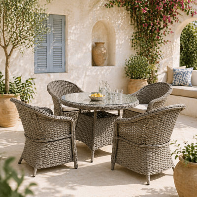 Wyld Haus Vifi Round 5-Piece Rattan-Style Outdoor Dining SetMixed Grey With Sand Brown CushionsGlass Table & 4 Armchairs from B&Q