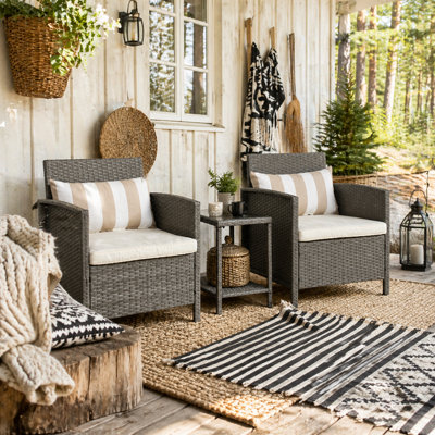 Wyld Haus Reha Rattan Light Grey 3-Piece Garden Bistro Set2 Cushioned Armchairs And 2-Tier Tempered Glass Table from B&Q