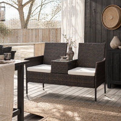 Wyld Haus Renata Faux Rattan 2-Seat Garden Chair With Integrated Coffee TableBrown With Cream Cushions from B&Q