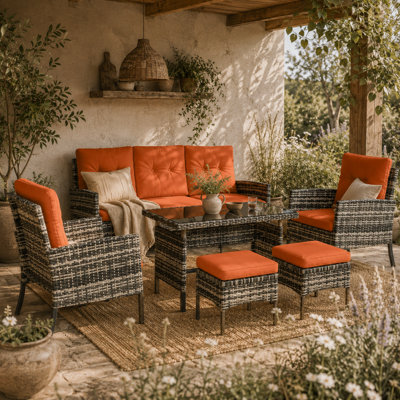 Wyld Haus Lodori 7-Seater Grey Rattan Outdoor Dining Set With Orange Cushions And Glass Table from B&Q