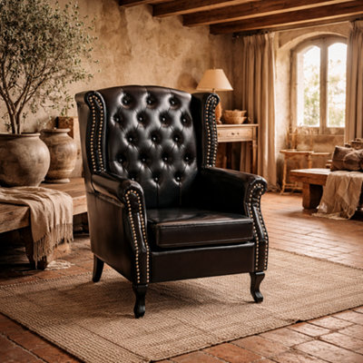Wyld Haus Nana Bafa Black Wingback Accent Chair With Chesterfield Tufting And Nailhead TrimFaux LeatherEucalyptus Frame from B&Q