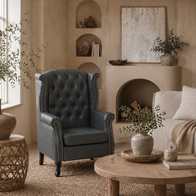 Wyld Haus Radima Grey Faux Leather Chesterfield Wingback Accent Armchair With Nailhead Trim 72W X 70D X 108H Cm from B&Q