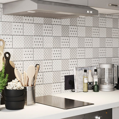 Black and white art deco style geometric tile kitchen splashback.