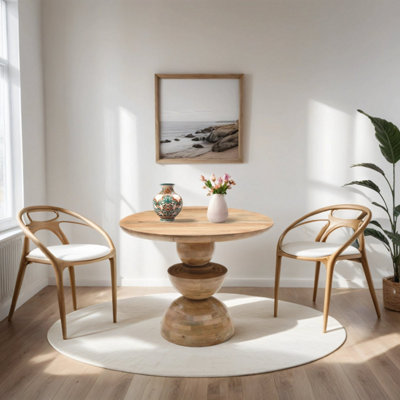 Merlin Mango Wood Round Dining Table from B&Q