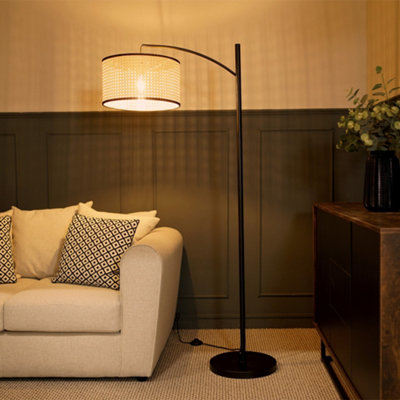 Valuelights Preto Black Metal Curve Stem Floor Lamp With A Natural Cane Wicker Shade With Black Trim from B&Q