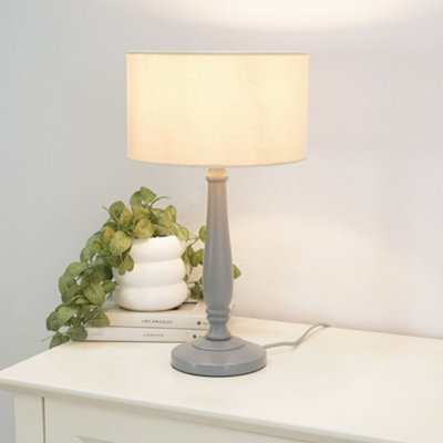 Valuelights Victoria Traditional Grey Wood Candlestick Table Lamp With Natural Drum Shade from B&Q