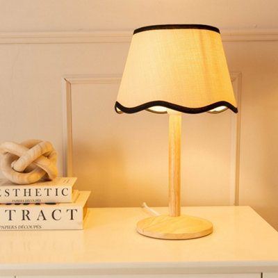 Valuelights Triston Natural Light Wood Stem Table Lamp With Scallop Black Trim Tapered Lamp Shade from B&Q