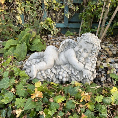 Vintage Cherub Statue Laying On A Grape from B&Q