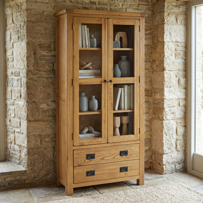 The Furniture Market Rustic Oak Glazed 2 Door 2 Drawer Tall Display Cabinet Unit from B&Q