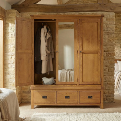 The Furniture Market Rustic Oak Triple 3 Door Mirrored Wardrobe With 3 Drawers from B&Q
