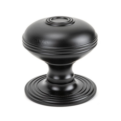 From The Anvil Aged Bronze Prestbury Centre Door Knob from B&Q