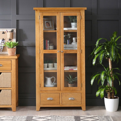 The Furniture Market Cheshire Oak Glazed 2 Door 2 Drawer Tall Display Cabinet Unit from B&Q