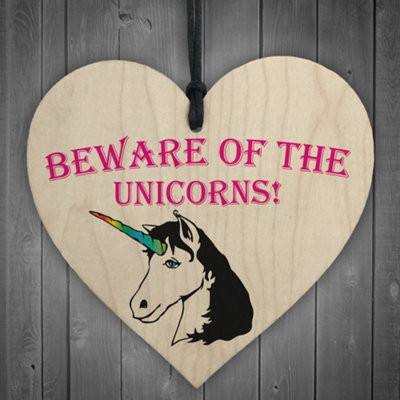 Red Ocean Beware Of The Unicorns Novelty Wooden Hanging Heart Plaque from B&Q