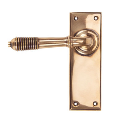 From The Anvil Polished Bronze Reeded Lever Latch Set from B&Q
