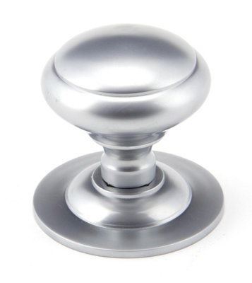 From The Anvil Satin Chrome Round Centre Door Knob from B&Q