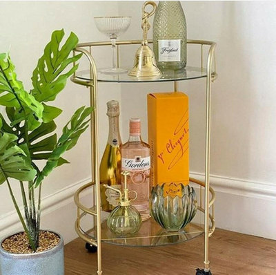 Spot On Dealz Drinks Trolley Kitchen Island Bar Cart Trolley Serving Cart With Two Glass Shelves Gold Mini Bar Table from B&Q