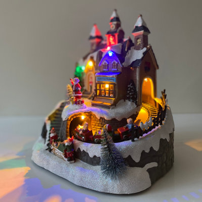Garden Selections Santa Christmas Scene Ornament With Lights Moving Train And Sound from B&Q