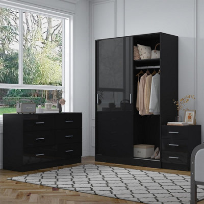 Reflect 2 Door Sliding Wardrobe6 Drawer Wide Chest3 Drawer BedsideBlack Gloss & Black OakModern Bedroom Furniture Set from B&Q