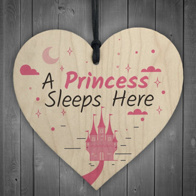 Red Ocean A Princess Sleeps Here Wooden Hanging Heart Baby Daughter Bedroom Plaque Girls Door Sign from B&Q