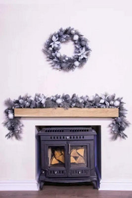 Christmas Tree World 180Cm Decorated Silver Mixed Pine Garland With White Poinsettia from B&Q
