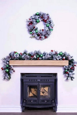Christmas Tree World 180Cm Flocked Decorated Mixed Pine Garland With Tartan Bows from B&Q
