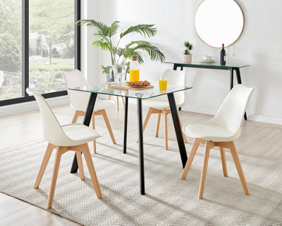 Furniturebox Seattle Scandi Inspired Glass And Black Leg Square Dining Table & 4 White Cushioned Stockholm Beech Wood Leg Chairs from B&Q