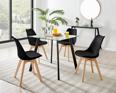 Furniturebox Seattle Scandi Inspired Glass And Black Leg Square Dining Table & 4 Black Cushioned Stockholm Beech Wood Leg Chairs from B&Q