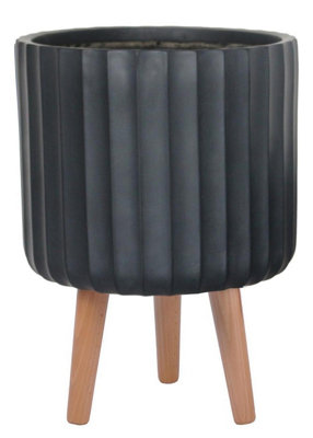 Idealist™ (Dia) 30Cm Black Reinforced Stone Flower PotFluted Planter On Wooden LegsIndoor Plant Pot D30 H41Cm from B&Q