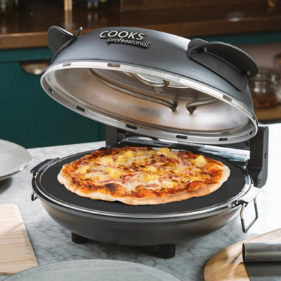 Cooks Professional Electric Pizza Oven Machine 1200W With Stone BaseWindowTimerS-Steel Paddles & Baking SheetGrey from B&Q
