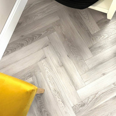 Embrace Herringbone Laminate Flooring Washed Oak 12mm from B&Q
