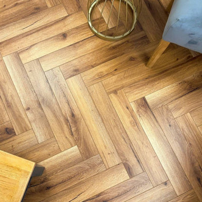 Embrace Herringbone Laminate Flooring Traditional Oak 12mm from B&Q