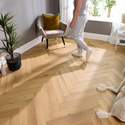 Embrace Herringbone Laminate Flooring Woodland Oak 14mm  Built-In Underlay from B&Q