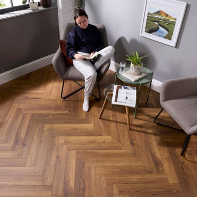 Embrace Herringbone Laminate Flooring Smoked Oak 14mm Built-In Underlay from B&Q
